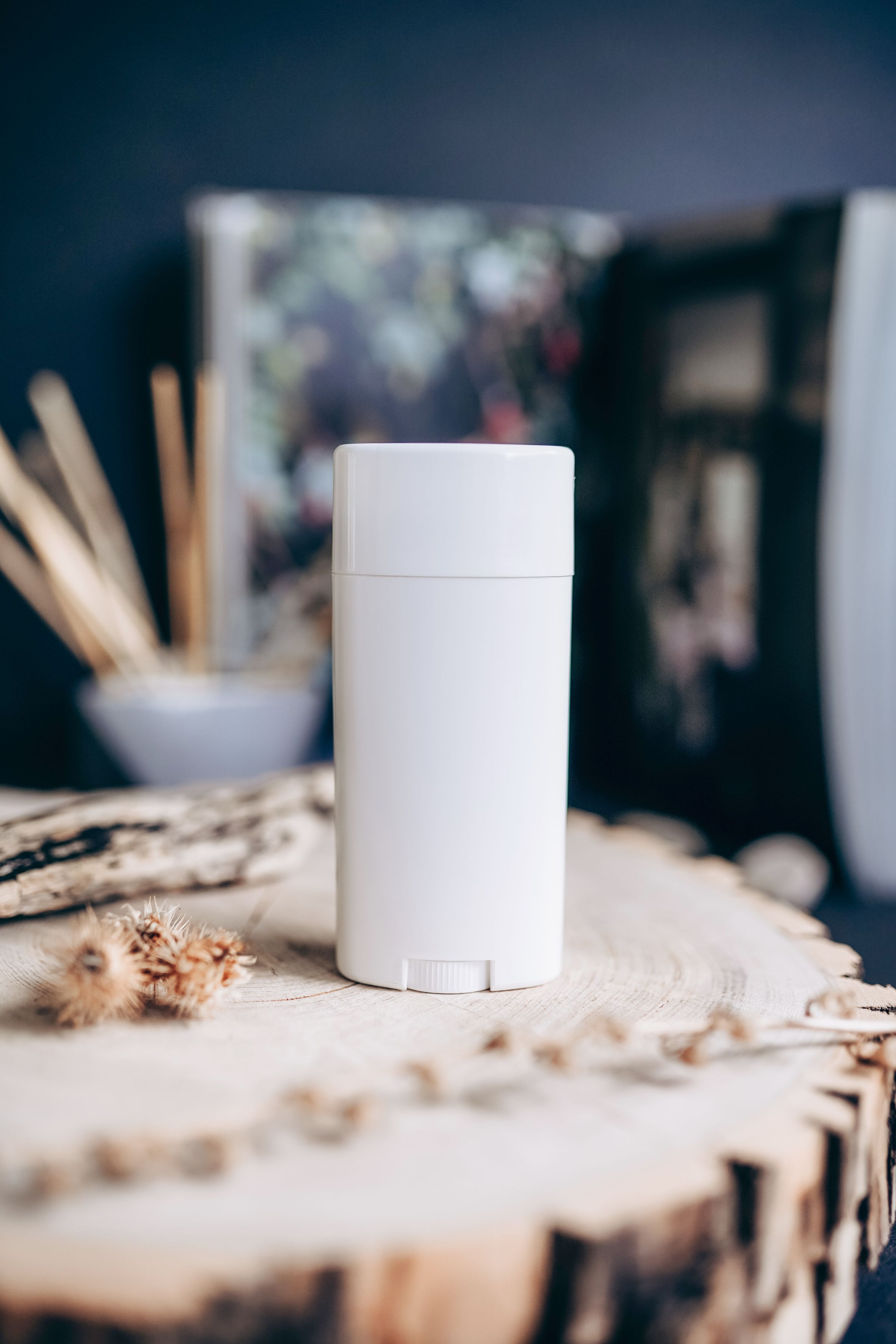 Unbranded white deodorant container illustrating an antiperspirant application
